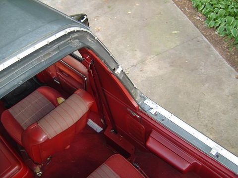 1986 Ford Bronco - Aluminum flat stock from Lows was used to connect the Kayline/STC snap rails to the Bronco using the factory hard top fastiners. No holes w…