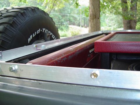 1986 Ford Bronco - The run agross the tailgate is reinforced with some L channel aluminum stock from Lows.