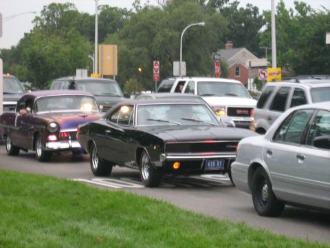 1988 Mercury Grand Marquis - A black 1968 Dodge Charger is seen in traffic, alongside other vehicles.