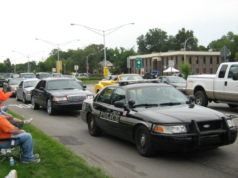 1988 Mercury Grand Marquis - A black police car leads a procession of vehicles during the Woodward Cruise in 2007.