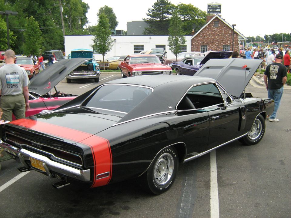 Black 1969 Dodge Charger with red racing stripes on rear quarter panel