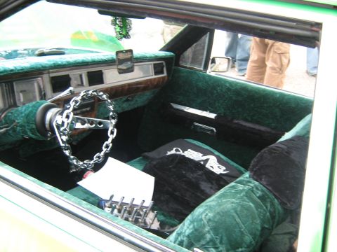 1988 Mercury Grand Marquis - Custom interior features green velvet seats and door panels, plus a unique chain steering wheel.