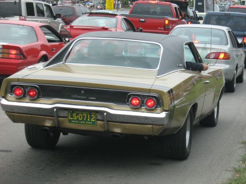 1988 Mercury Grand Marquis - A gold 1969 Dodge Charger is seen in traffic, with a Michigan license plate.