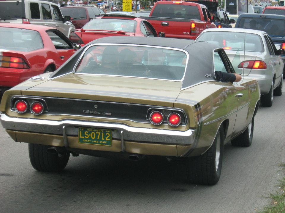 Gold 1969 Dodge Charger in traffic, Michigan plate LS-0712