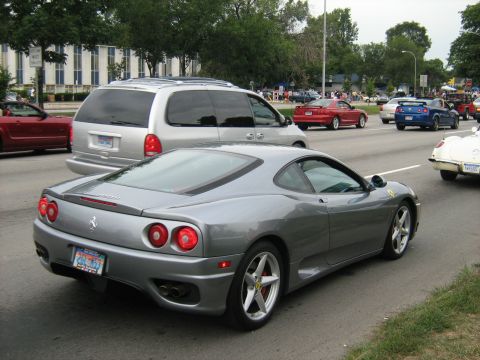 1988 Mercury Grand Marquis - A silver Ferrari 360 Modena is seen from the rear while driving in traffic during the Woodward Cruise 2007.