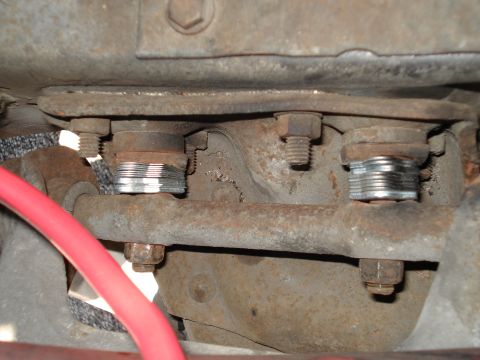 1979 Chevrolet C/K Pickup - Detail shot of vehicle suspension components with visible rust and new hardware.