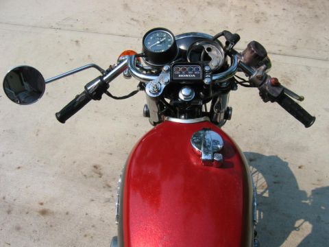 1985 Ford Crown Victoria LTD - Motorcycle's front end, showing the fuel tank, handlebars, and instrument cluster.
