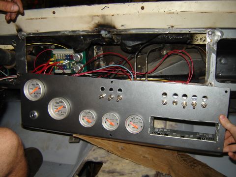 1972 Ford Bronco - A custom dashboard panel is installed, several gauges and toggle switches, along with an empty radio slot.