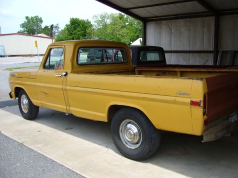1971 Ford F-250 - Left rear view, truck has sliding window, in-cab fuel tank only, and a dealer step bumper out back.
