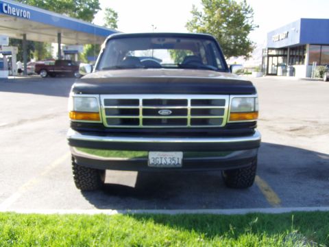 1994 Ford Bronco - Front view of a 1994 Ford Bronco parked in front of a Chevron gas station.