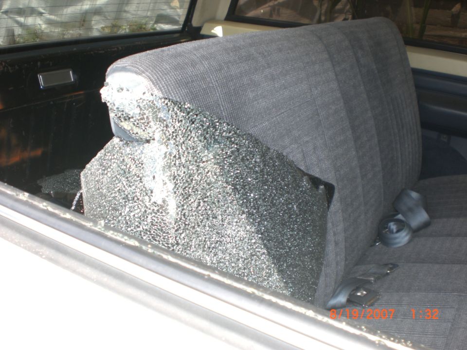 Broken rear window and seat inside a vehicle