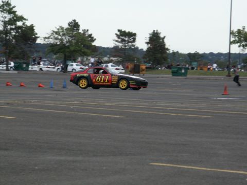 2001 Mercury Grand Marquis - A race car with number 611 on its side navigates a course marked by cones.