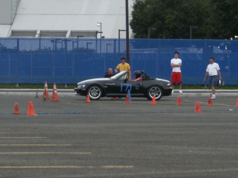 2001 Mercury Grand Marquis - A black convertible sports car with racing number 171 is set up for an event with cones on the ground.