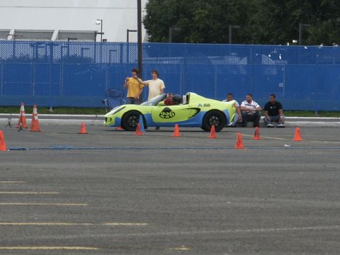 2001 Mercury Grand Marquis - A two-tone sports car is set up for an event with cones marking a course.
