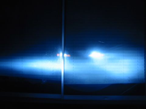 1995 Ford Thunderbird - Headlights with a blue tint are illuminated, with the Supermotors.net logo in the lower right corner.