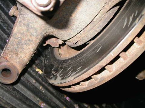 1990 Ford Bronco - I suppose previous owner thought hitting the brake rotor with a hammer was a good idea.