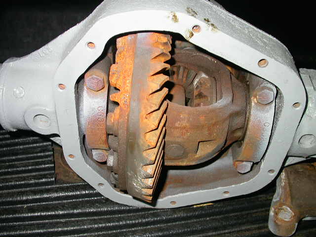 rusty carrier, broken tooth on ring gear, and the carrier bearing caps aren't even tightened down.