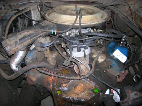 1978 Ford F-250 - Close-up view of an engine bay, showing various components and signs of age.