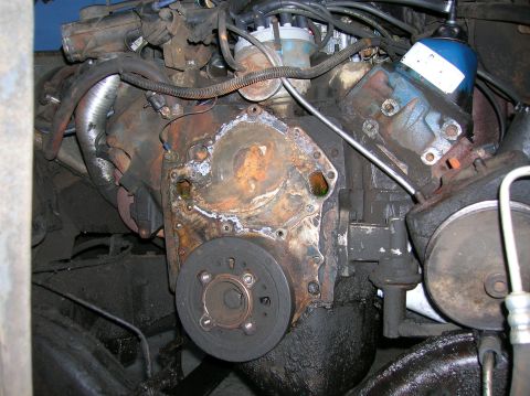 1978 Ford F-250 - Engine components showing signs of wear and tear, with a focus on the block and pulley system.