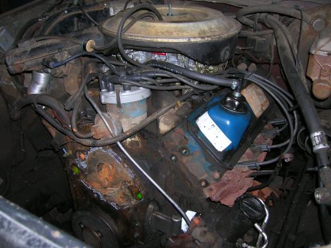 1978 Ford F-250 - Close-up view of an engine bay, showing various components and signs of wear.