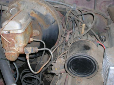 1978 Ford F-250 - Close-up view of engine bay components, including a brake master cylinder and tangled wiring.