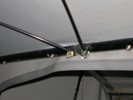 1995 Ford Bronco - Close-up of interior roof structure, showing support bars and fabric.