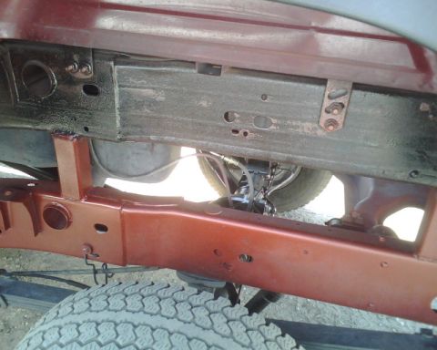 2000 Chevrolet Tahoe - Close-up of the undercarriage, showing frame and suspension components.