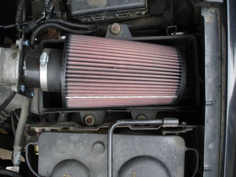 1994 Ford Bronco - Close-up of an aftermarket engine air intake filter system.