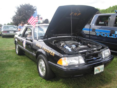 1991 Ford LTD Crown Victoria - Black Ford Mustang Florida Highway Patrol trooper car with hood raised, 'FHP' on the hood, 'State Trooper' door lettering and a small US fl…