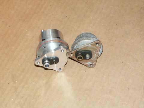 1990 Ford Mustang - Two fuel pressure regulators, one new and one used, are shown side-by-side.
