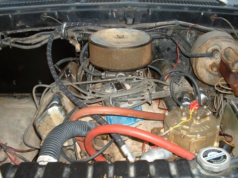 1978 Ford Bronco - Close-up view of the engine compartment, showing various components and hoses.