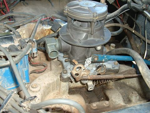 1978 Ford Bronco - Engine bay view showing a carburetor and various hoses and wires.