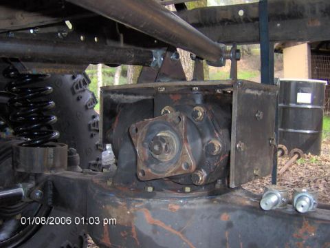 1979 Ford F-150 - The image shows a close-up view of a vehicle's differential housing and suspension components, with a tire in the background.