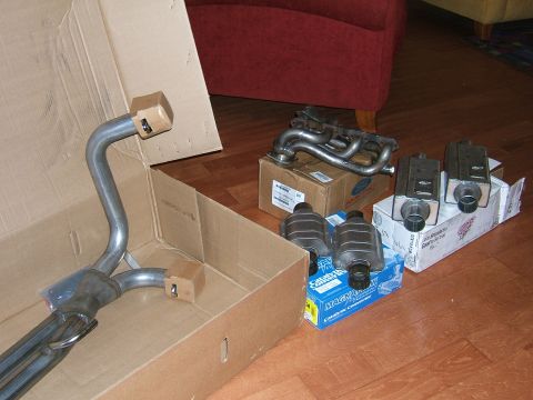 1991 Ford Bronco - Various exhaust system components, including a manifold and catalytic converters, are displayed.