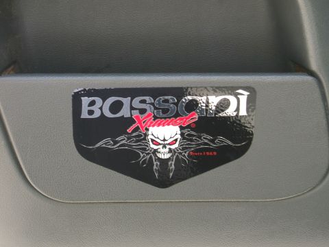 1991 Ford Bronco - A Bassani Exhaust sticker a skull graphic and the text 'Since 1969' is visible on a gray interior panel.
