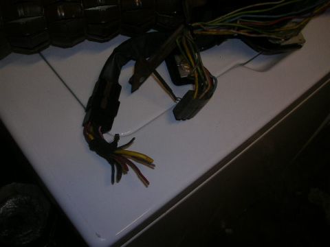1975 Ford Ranchero - A close-up view of a complex automotive wiring harness, showing multiple colored wires and connectors.