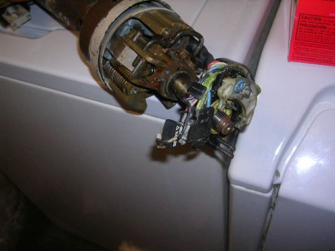 1975 Ford Ranchero - Close-up of a car's ignition switch and its wiring harness, showing internal mechanisms.