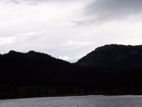 1972 Ford Ranchero - A mountain lake scene with silhouetted peaks against a dramatic sky.