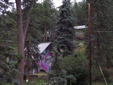 1972 Ford Ranchero - A view of houses among trees on a hillside, with a prominent utility pole in the foreground.