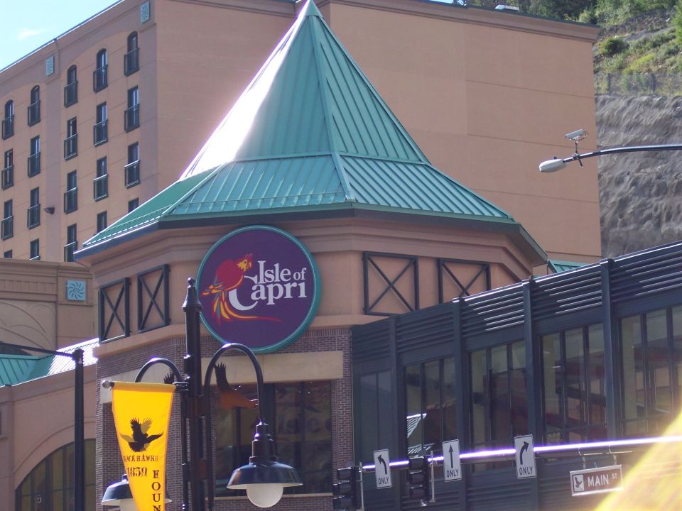 Isle of Capri casino building with parrot logo sign and teal roof