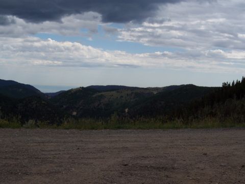1972 Ford Ranchero - Expansive view of rolling hills and distant mountains under a dramatic sky.