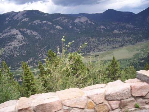 1972 Ford Ranchero - View of a mountain range and valley from a scenic overlook with a stone wall in the foreground.