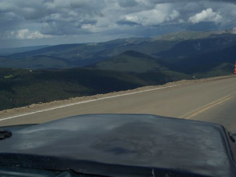 1972 Ford Ranchero - Driving through a mountainous region with a cloudy sky overhead.