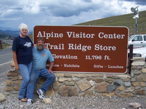 1972 Ford Ranchero - A couple poses for a photo in front of the Alpine Visitor Center sign at an elevation of 11,796 ft.