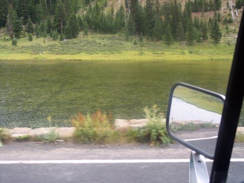 1972 Ford Ranchero - Driving past a calm lake surrounded by trees on a sunny day.