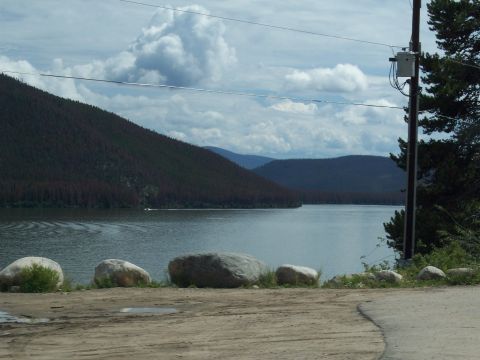 1972 Ford Ranchero - A scenic view of a lake surrounded by mountains on a cloudy day.