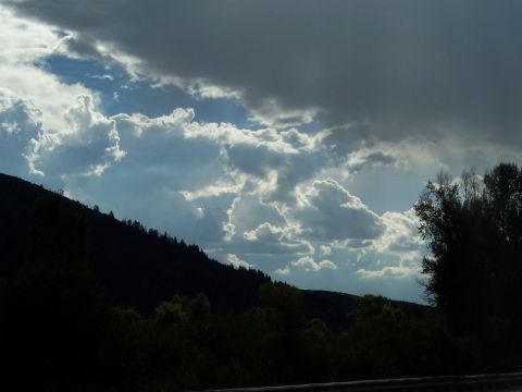 1972 Ford Ranchero - Dramatic clouds gather over a silhouetted hillside, hinting at an approaching storm.