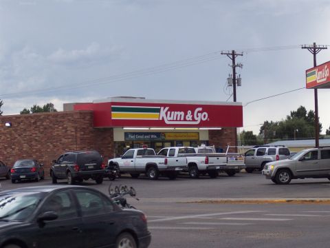 1972 Ford Ranchero - Several vehicles are parked in front of a Kum & Go convenience store.