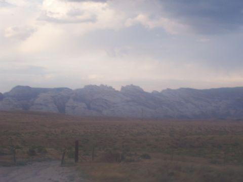 1972 Ford Ranchero - Expansive view of a mountain range and arid landscape under a dramatic sky.