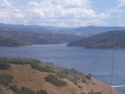 1972 Ford Ranchero - A scenic view of a vast lake with distant mountains under a partly cloudy sky.